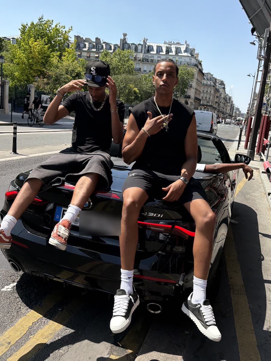 Sitting on a car in Paris